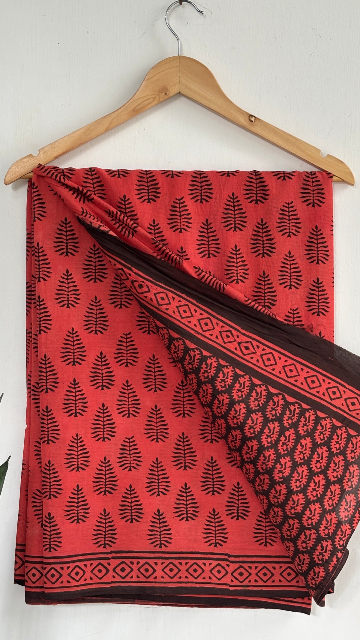 Coral Red and Black Leaf Print Mul Cotton Saree with Black Geometric Border