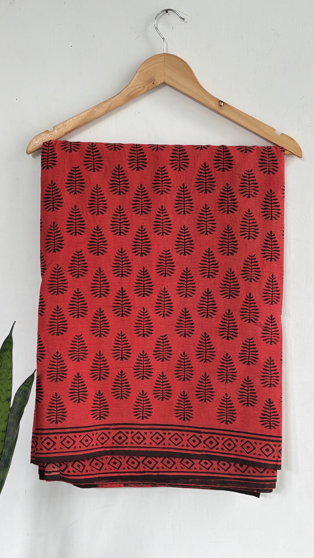 Coral Red and Black Leaf Print Mul Cotton Saree with Black Geometric Border