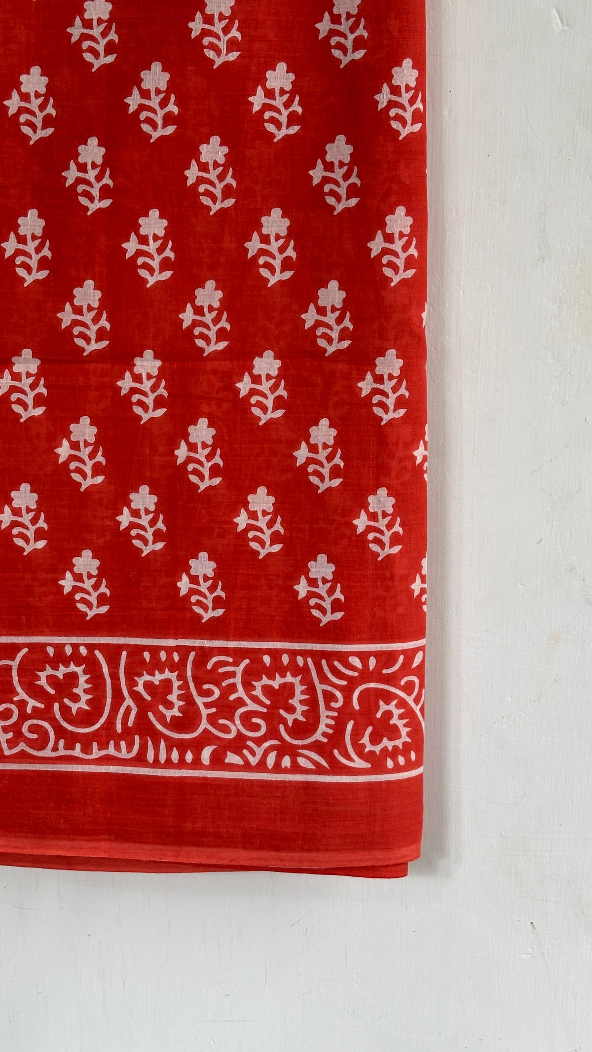 Vermilion Red Floral Buti Print Mul Cotton Saree with White Ornamental Border